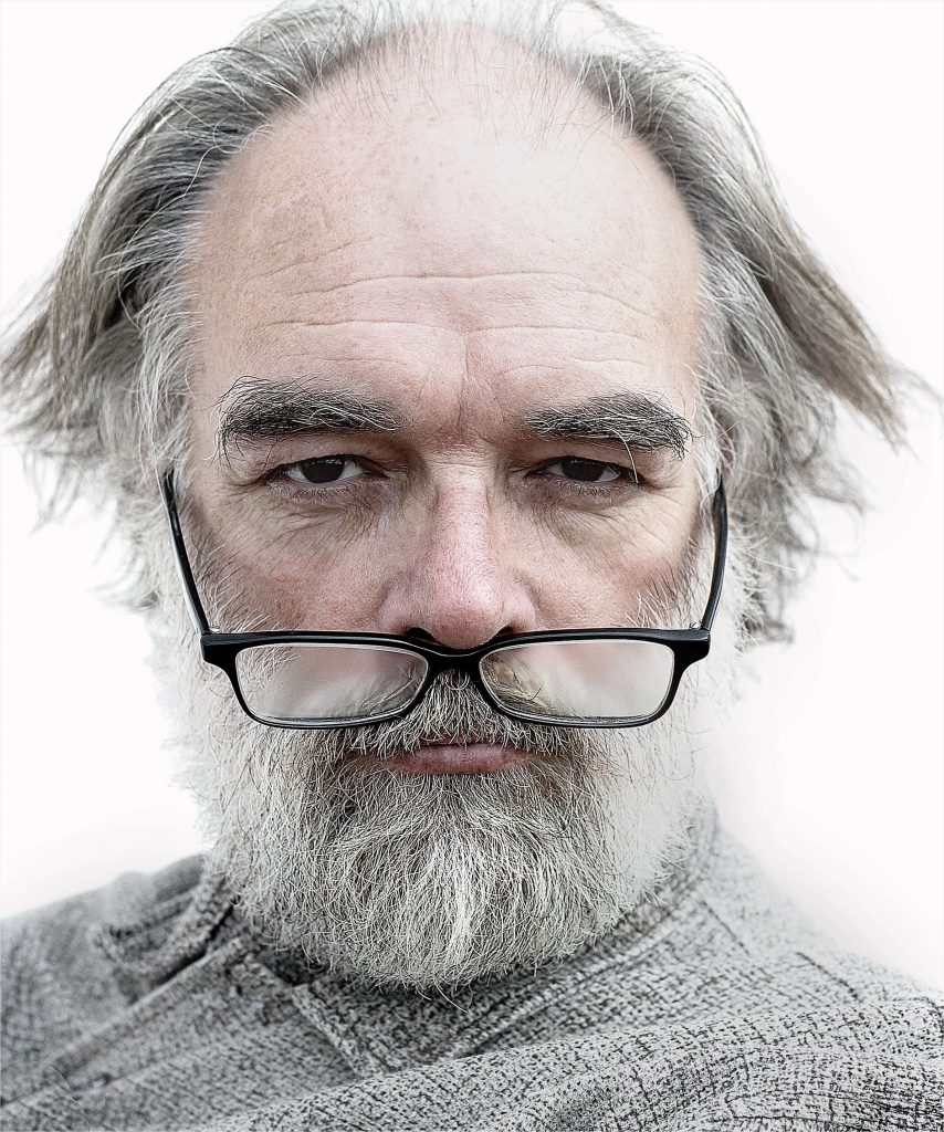 older man with glasses on nose